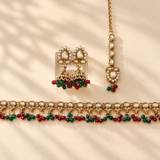 Raya dark red and dark green polki necklace set with gold finish matching jhumka earrings and maang tikka