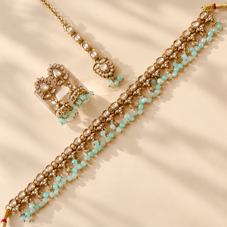 Raya mint green polki necklace set with antique gold finish white polki style stones mint green bead fringe and matching jhumka earrings