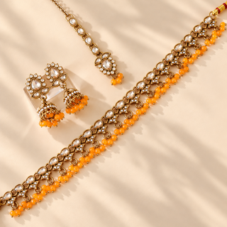 Raya orange polki necklace set with matching gold finish jhumka earrings and maang tikka