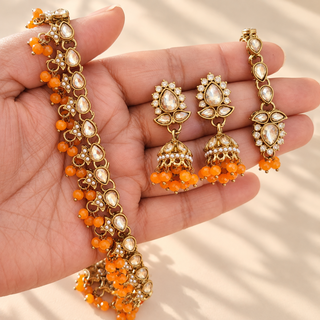 Raya orange artificial jewellery necklace set close-up gold finish earrings and tikka