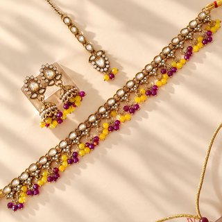 Raya purple and yellow polki necklace set gold finish with matching jhumka earrings and maang tikka