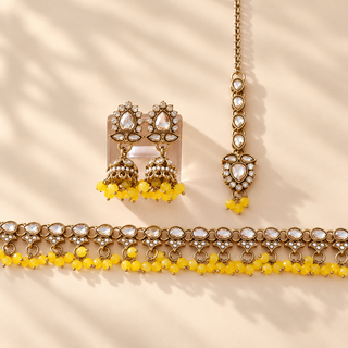 Raya yellow polki necklace set with matching earrings and maang tikka full jewellery product photograph