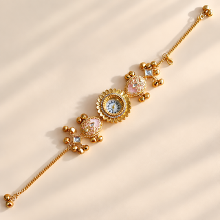 Rosalie pink gold Kashmiri watch flat lay with floral dial and ghungroo charms