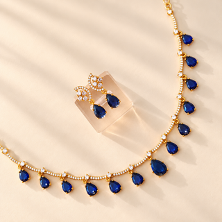 Imogen royal blue cubic zirconia necklace set and gold finish earrings close-up