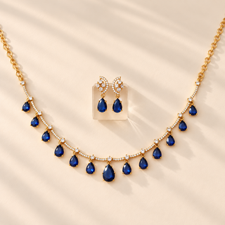 Imogen blue CZ diamond necklace set in gold finish with matching earrings