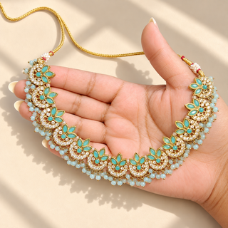 Rosamund light blue kundan style Indian necklace with turquoise floral crescent motifs and pale blue bead fringe