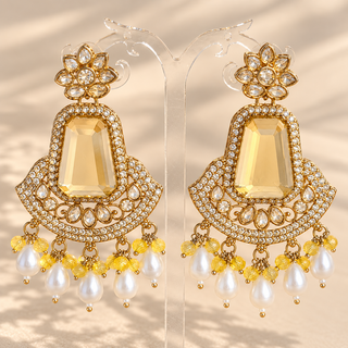 Rosamund yellow polki gold finish statement earrings with pale yellow centre stones, clear stones and pearl drops front view