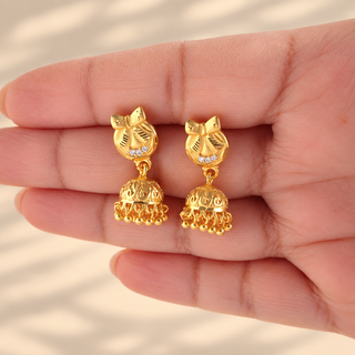 Tansy gold finish 2 cm small jhumki earrings with cubic zirconia style stones in hand