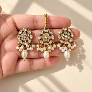 Close-up Winifred white kundan jewellery set gold finish with white pearl beads and matching earrings